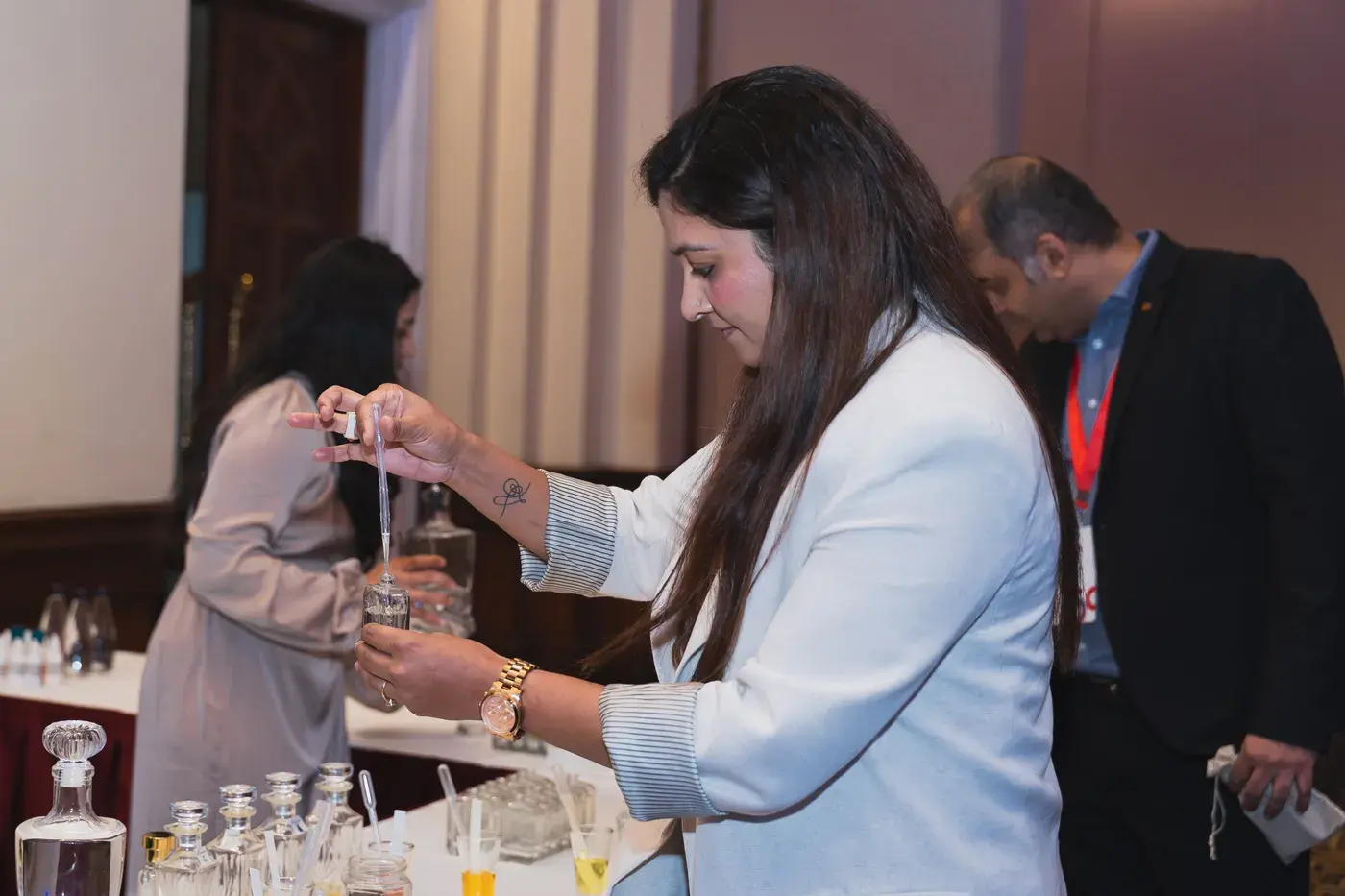 Guests lighting the ceremonial lamp at an office inauguration
